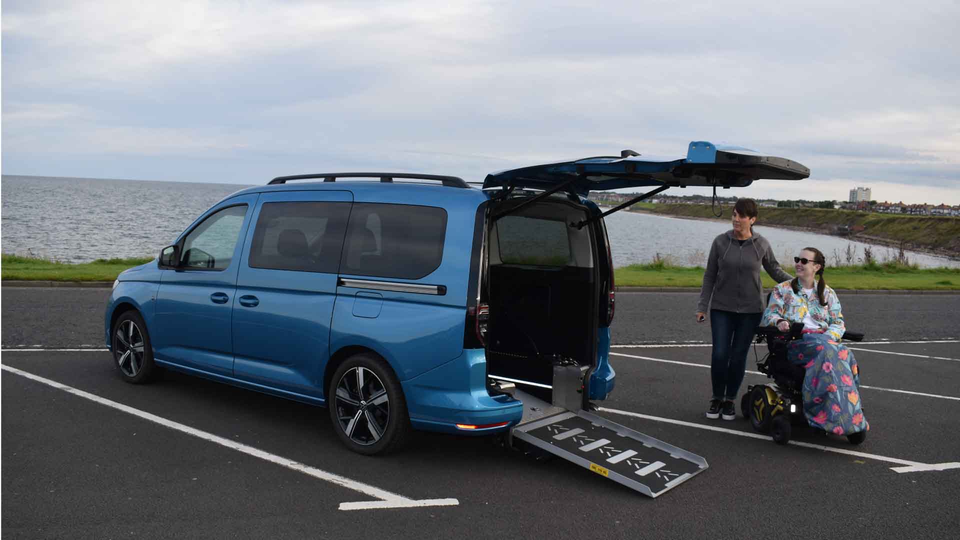 Lewis Reed Group | British Supplier of Wheelchair Accessible Vehicles | Volkswagen Caddy Maxi 5 side view with ramp down