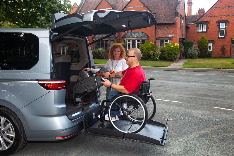 Lewis Reed Group | British Supplier of Wheelchair Accessible Vehicles | Wheelchair user using rear lift